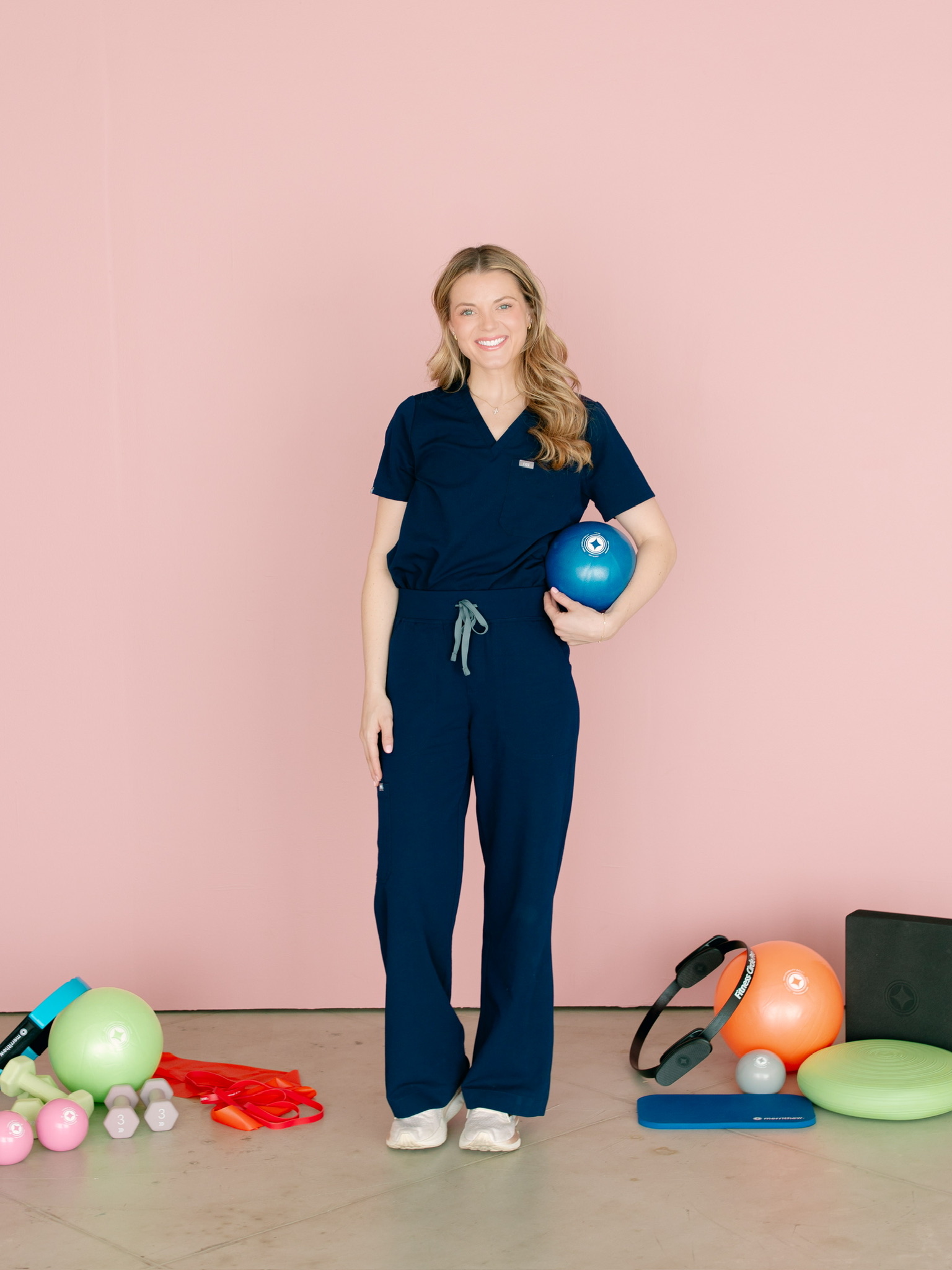 Channing Stewart, Doctor of Physical Therapy, with Pilates equipment in her Lubbock studio